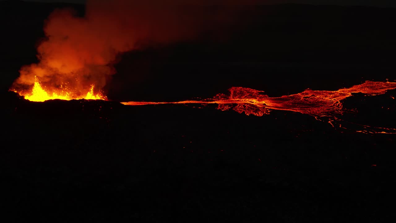 Stunning orange glow from lava river at night in Iceland, Litli-Hr&uacute;tur volcano