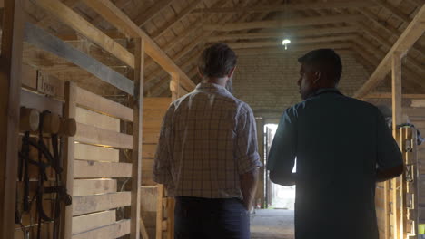 people talking at the stables