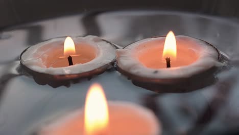 candles floating in water