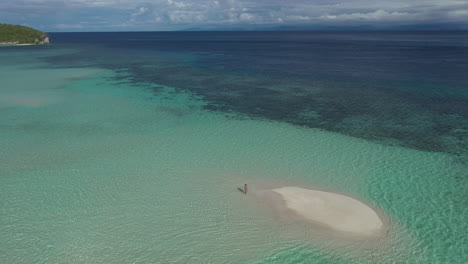 tranquil island sandbar with person