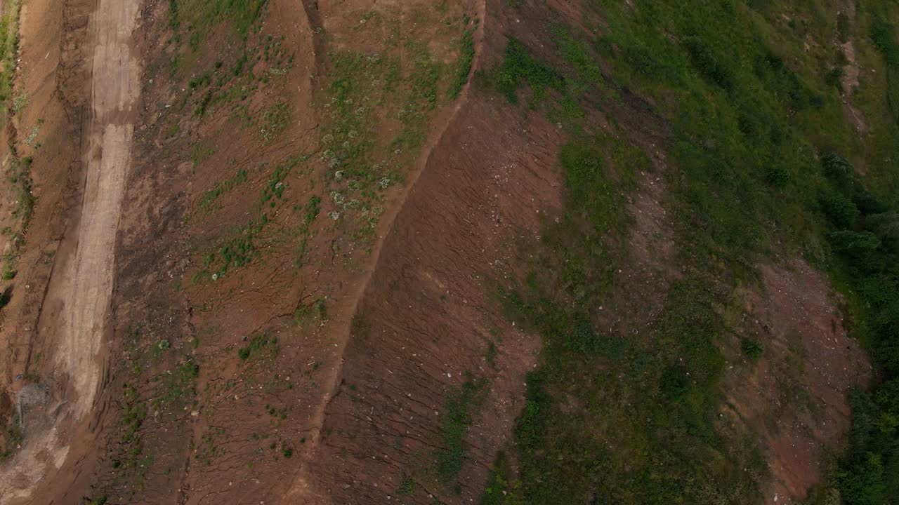 Household waste landfill. Closed for processing. Environment protection. Shooting closer to the subject. Close-up shot. Aerial photography
