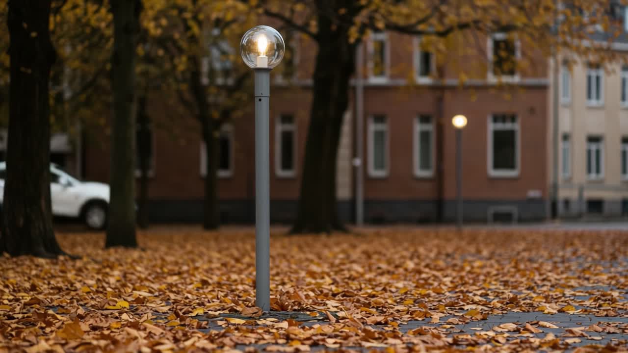 A Serene Autumn Scene Featuring a Lamp Post Surrounded by Vibrant Yellow Leaves and a Softly Illuminated Background, Evoking a Peaceful Outdoor Atmosphere