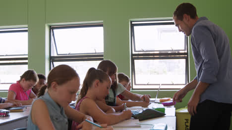 male teacher teaching in the class