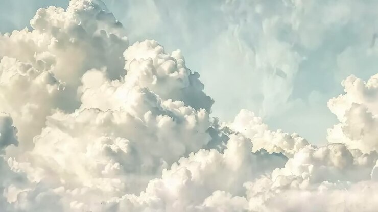A serene video of fluffy clouds captured from a low-angle perspective, showcasing a dreamy, ethereal