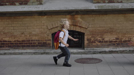 a child running to school and a mother hugging her child