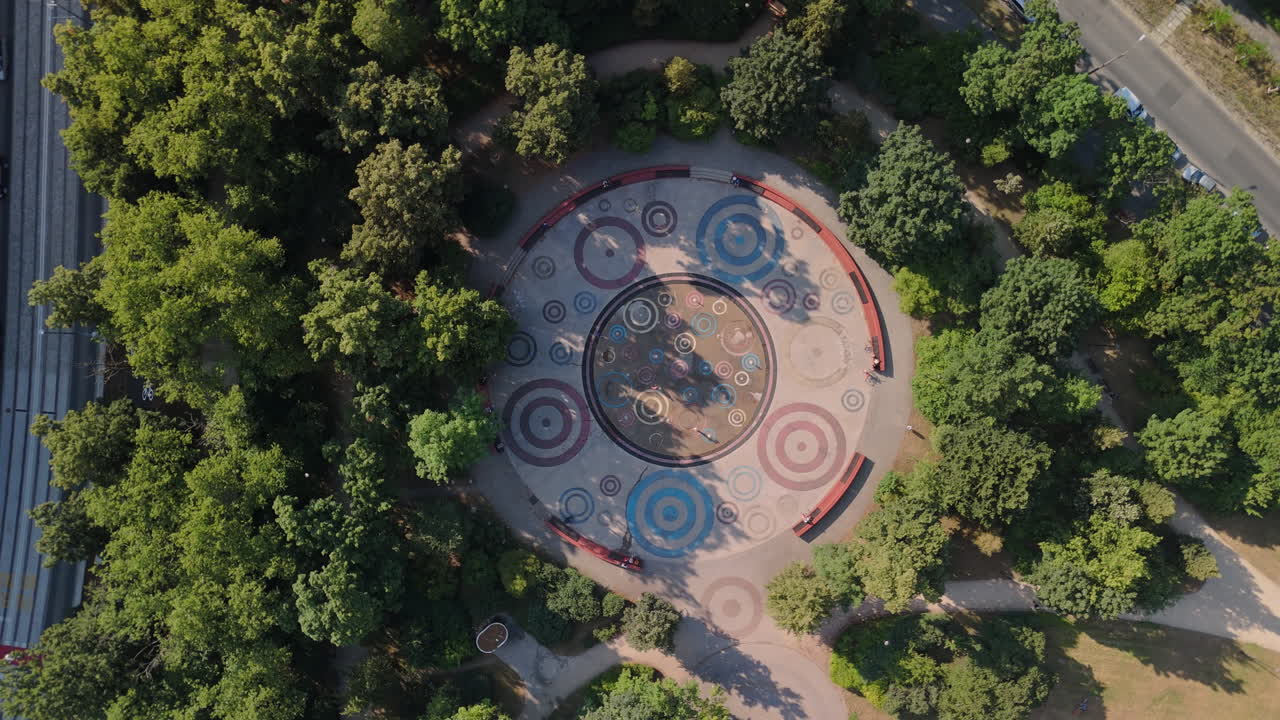 Aerial View of a Park with Circular Mosaic Design