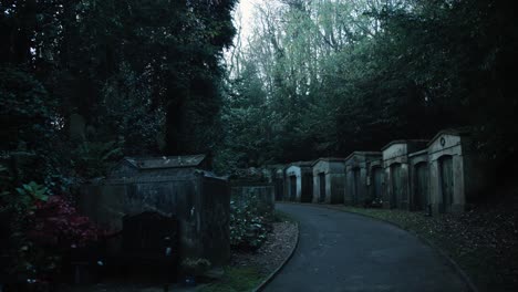 crypts along a road through an english in the cemetery