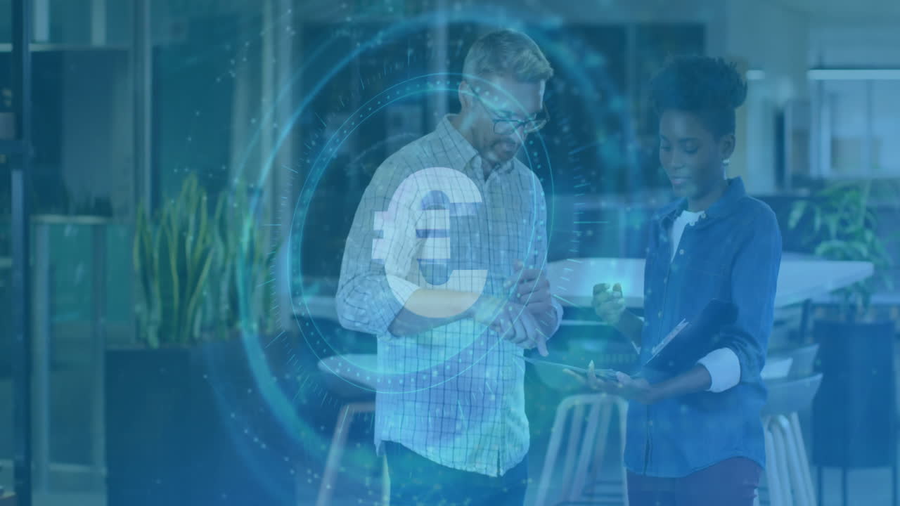 Two colleagues reviewing financial data in office, showing hologram Euro symbol, circular charts