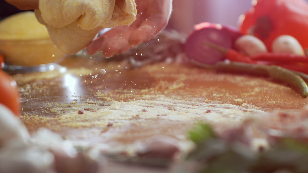Preparing dough for pizza