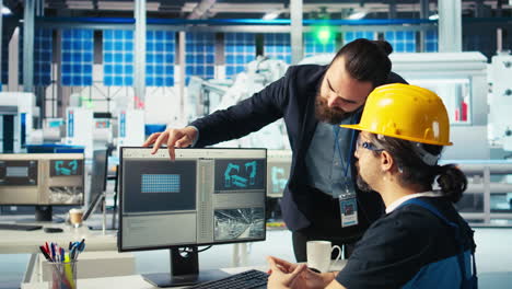 solar panel plant manager showing engineer how to develop prototypes