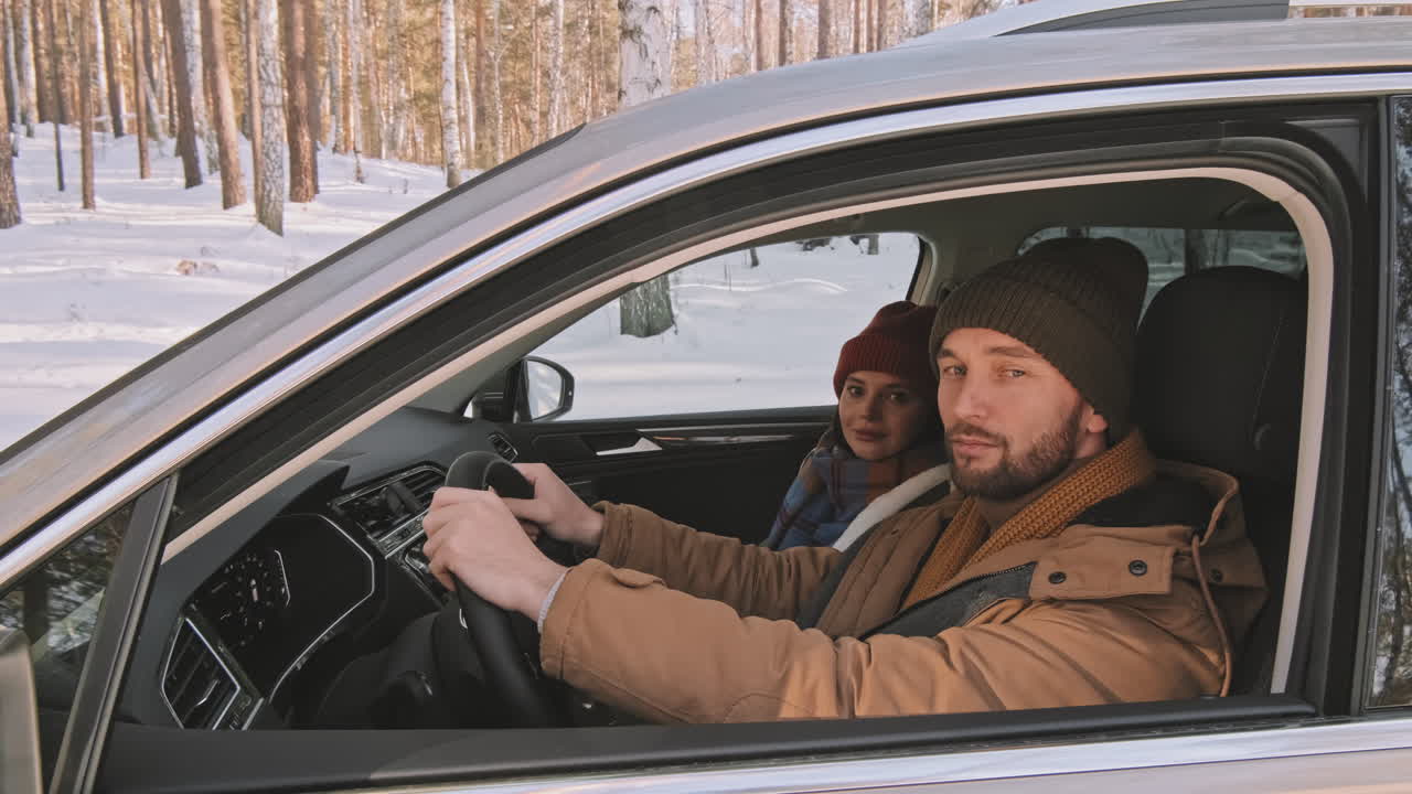 Portrait of Couple in Car in Winter