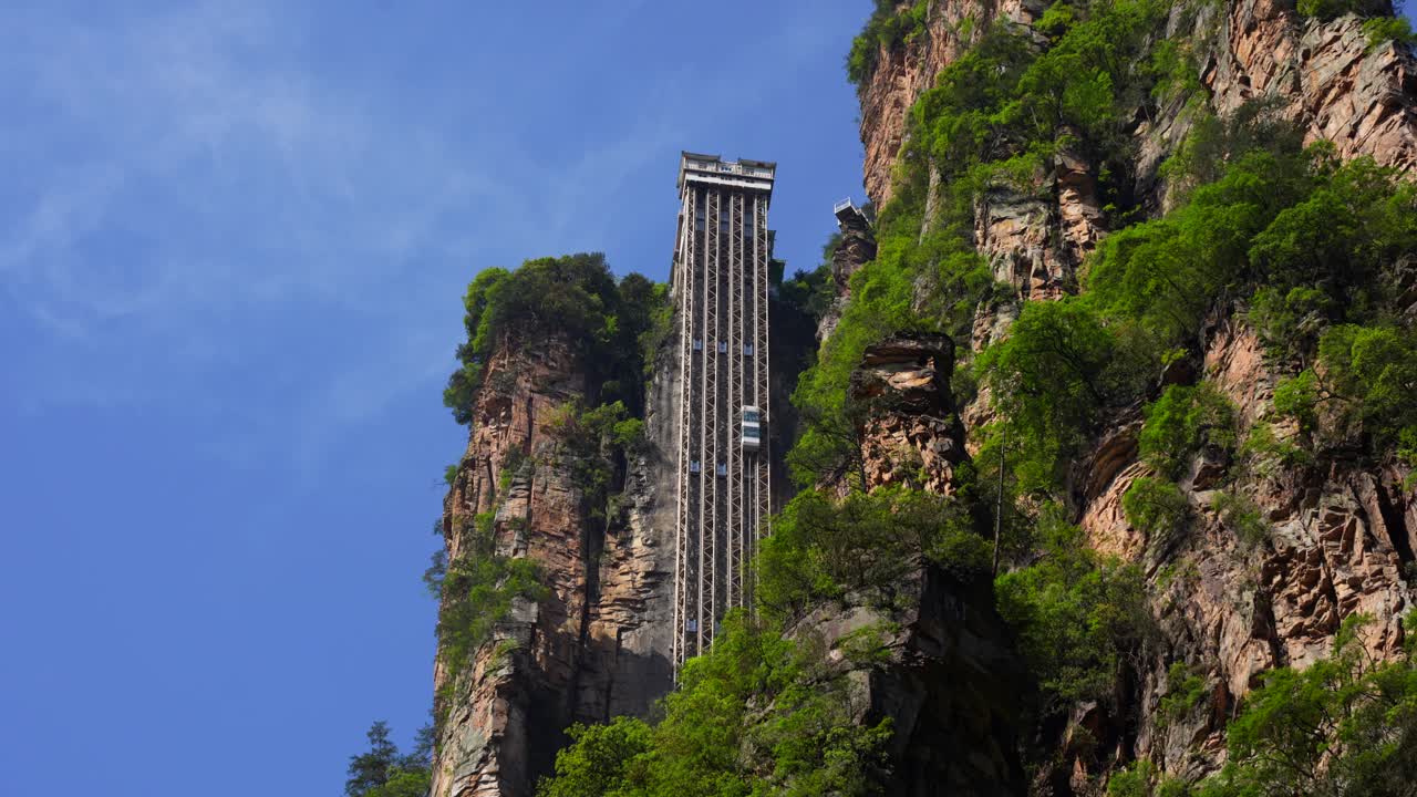 Lift cabin going up hill in Bailong Elevator in Zhangjiajie, China. Establisher