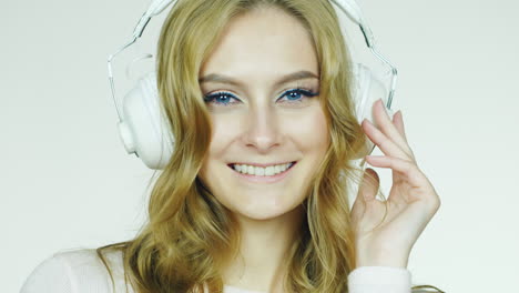 portrait of an attractive woman listening to music on headphones hd video