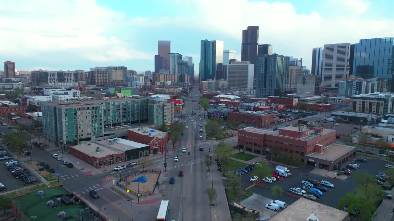 Downtown Denver Rhino art district cityscape businesses buildings aerial drone Colorado tall skyscrapers cars streets spring summer afternoon sunset landscape stormy clouds sunny upwards motion