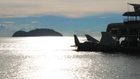 A-close-up-of-a-ferry-at-sea-in-the-reflection-at-sea-CROP-Slowmo