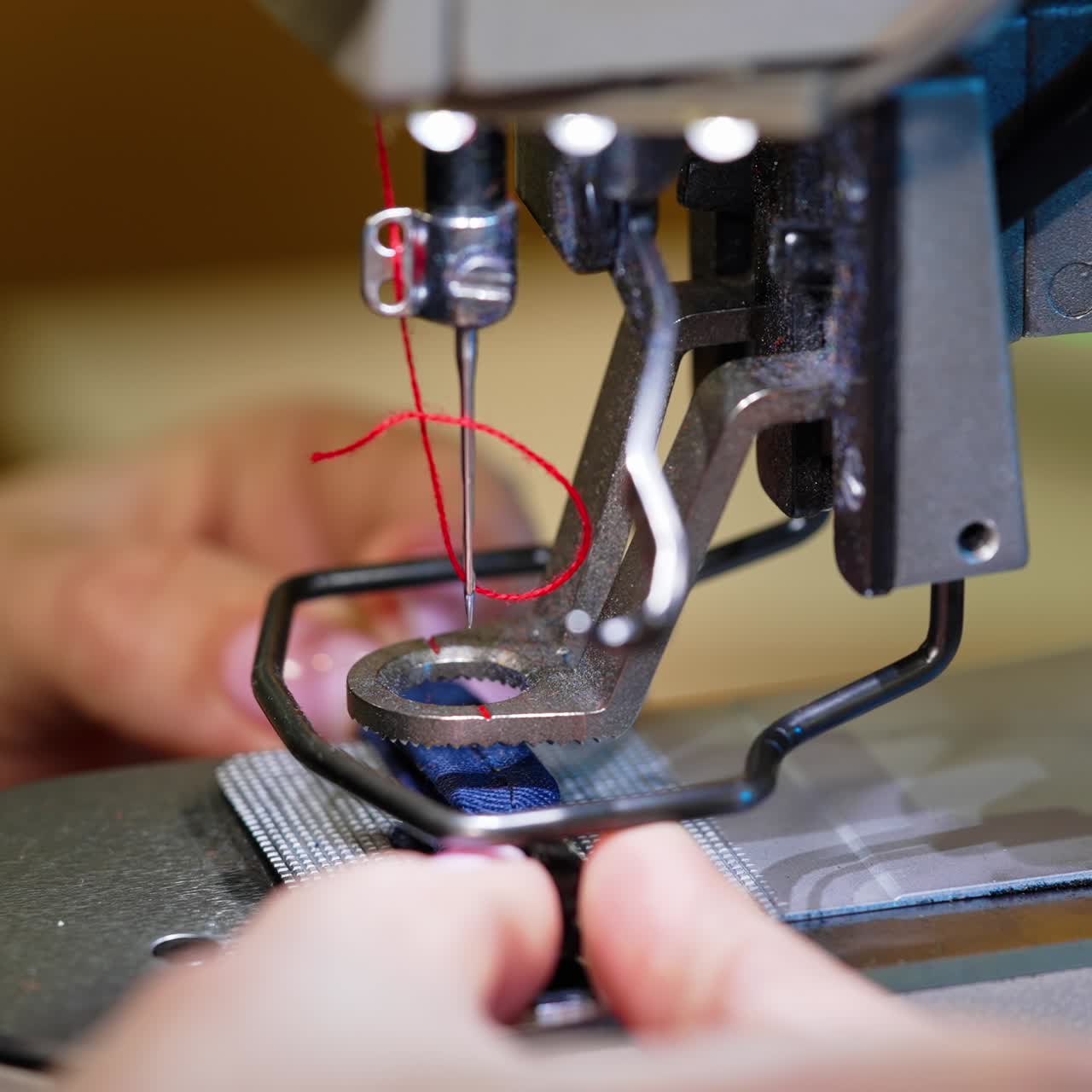 Sewing modern machine close up. Textile needle sewing equipment