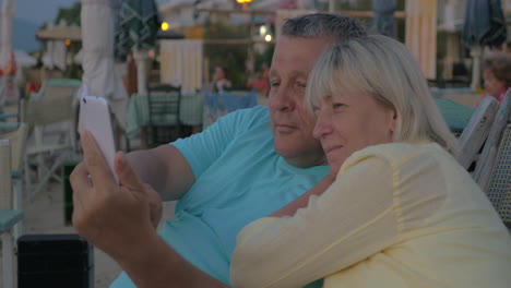 resting people taking selfie at smartphone