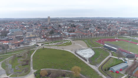 aerial shot tongeren city and de motten recreation park on cloudy day