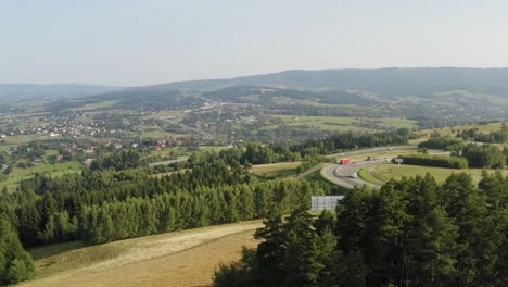 Beautiful-Footage-of-Highway-Between-Tatra-Mountains-in-Slovakia-With-Isolated-Houses-and-Green-Trees---Wide-Shot