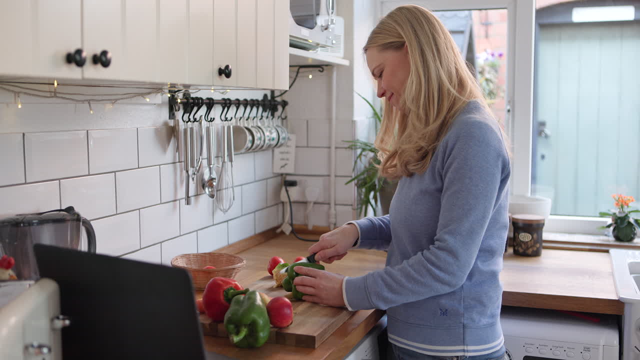 Woman Cooking with Vegetables in the Kitchen