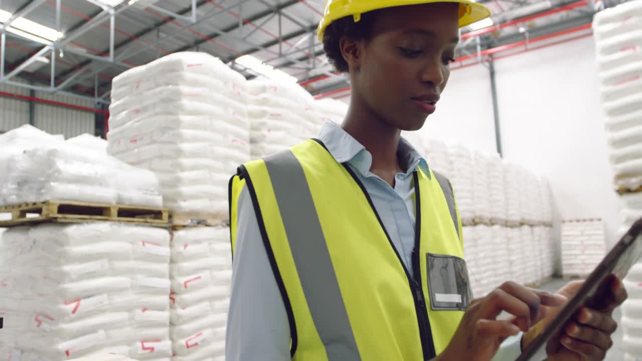 Warehouse lead tapping tablet initiating transparent world map overlay monitoring supply chain