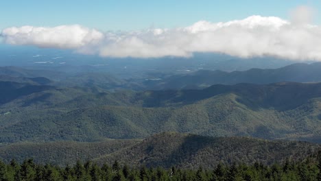 aerial flight over a mountain ridge in western north carolina during the early fall season