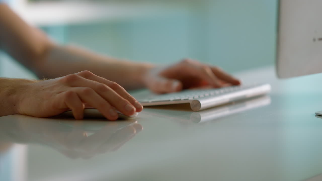 Closeup hands scrolling mouse at office desk. Worker using wireless device.