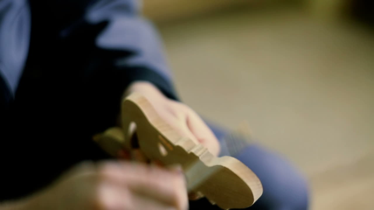 Carpenter Sending Piece Of Timber In His Workshop. Carpenter using electric sander. Carpenter sanding a wood with sander