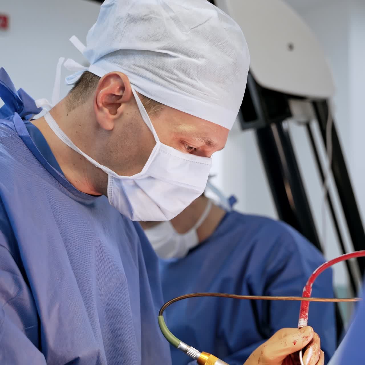 Team surgeon at work in operating room. Modern equipment in operating room. Medical devices for neurosurgery.