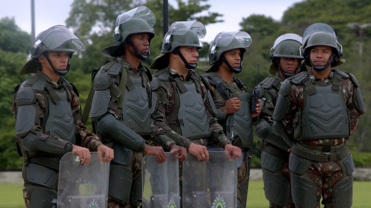 Riot Police Officers in Protective Gear Standing Ready