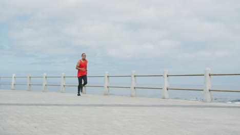 side view man with prosthetic leg running