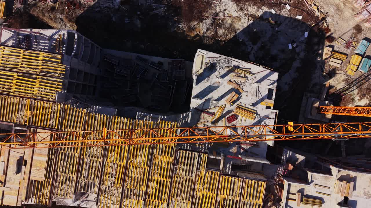 Aerial Top-Down View of a Large Construction Site with Crane