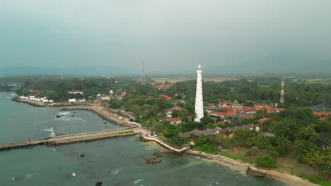 drone circles cikoneng dutch lighthouse from a distance in banten indonesia java 4k 60fps