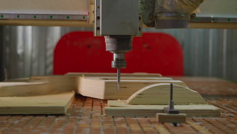 cnc router machine carving intricate pattern on plywood with precision, industrial woodworking