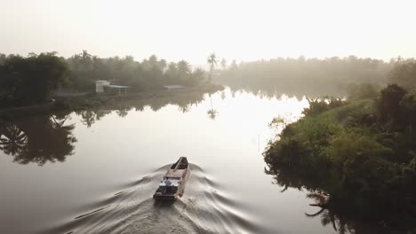 the-boat-goes-on-the-river-in-the-morning-dawn-sunrise-Boats-on-the-Mekong-River,-Vietnam-location:-Ben-Tre-province