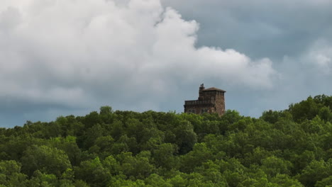 the dromborg castle amidst forested mountainside of ozark mountains in fayetteville, arkansas