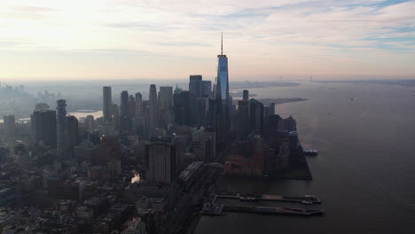 Aerial-view-of-the-western-Lower-Manhattan-skyline,-fall-morning-in-New-York,-USA