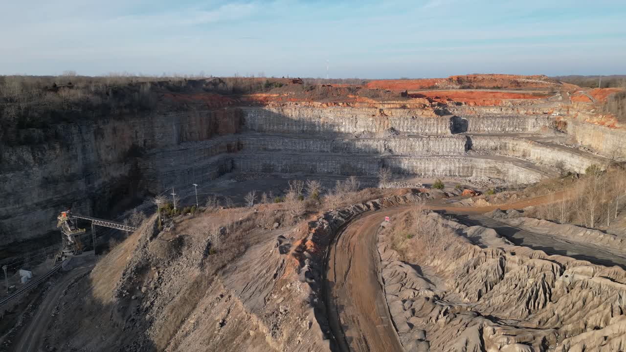Flying toward open pit at gravel, sand, and crushed stone mine in Clarksville Tennessee
