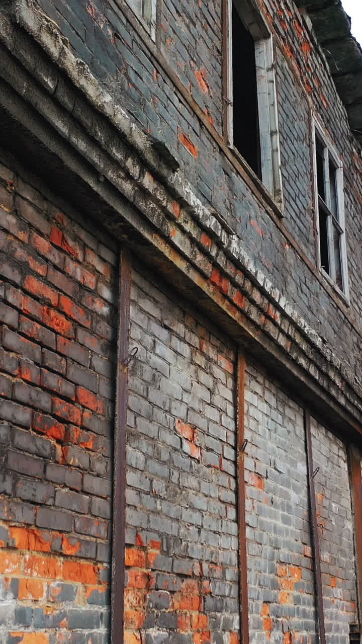 Abandoned ruined industrial factory building, ruins and demolition concept. Aerial view Vertical video