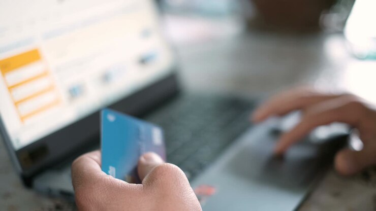 Man using credit card for casual shopping on laptop,web pay,tech e-commerce