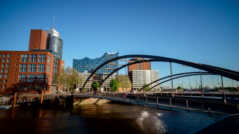 niederbaumbrucke bridge with people and cars moving above. hafencity, hamburg, germany