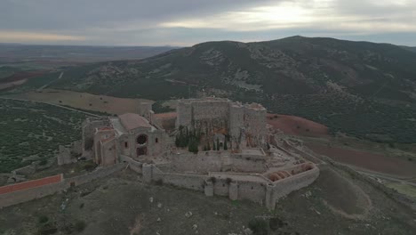 drone orbit majestic calatrava la nueva castle and sacred convent on cloudy day