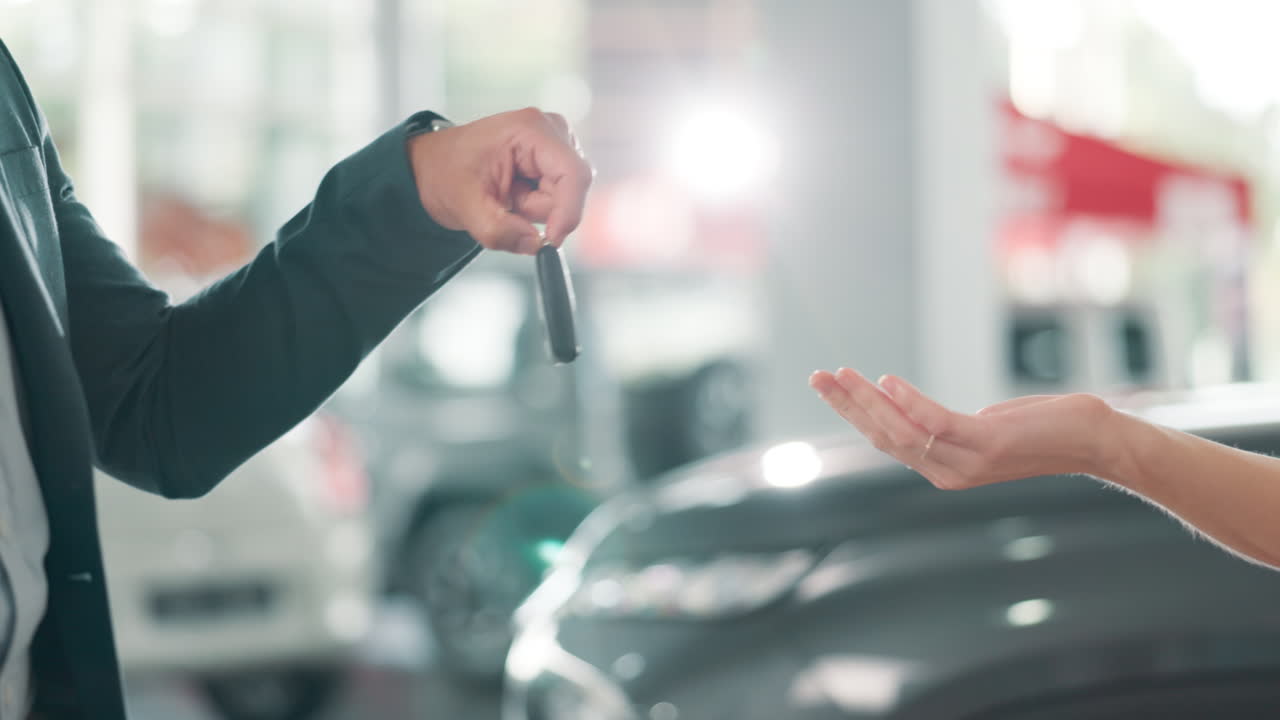 Handing over car keys in a dealership