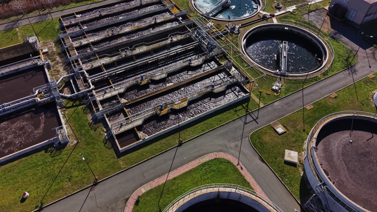 Wastewater treatment plant in operation on a sunny day near the river