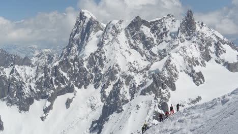 Mountaineers-on-Snow-Capped-Mountain-Hills,-Climbing-on-High-Elevation