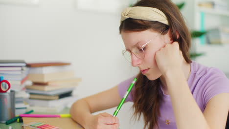 concentrated young student studying for a test at school