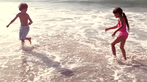 cute children having fun with water