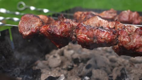 grilled pork skewers on charcoal grill