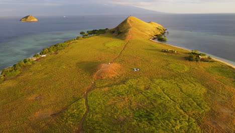 aerial view of kenawa island at sunset in sumbawa, indonesia - drone shot