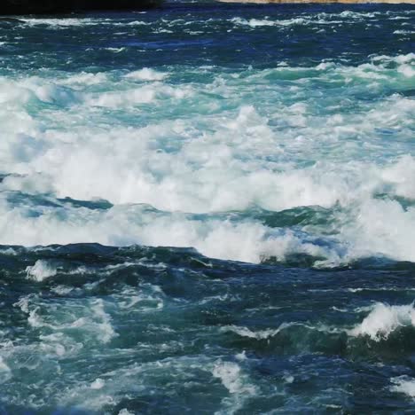 stormy water in a mountain river viewed from above 2